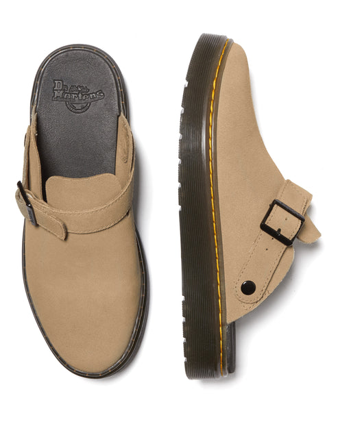 Two tan mules with buckled straps, thick soles and yellow stitching.
