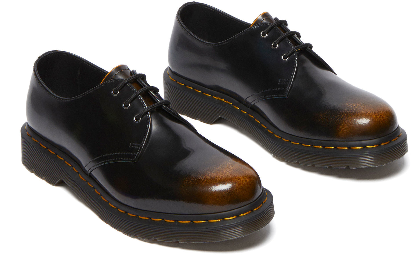 Pair of shiny black leather oxfords with brown toe, and black laces.