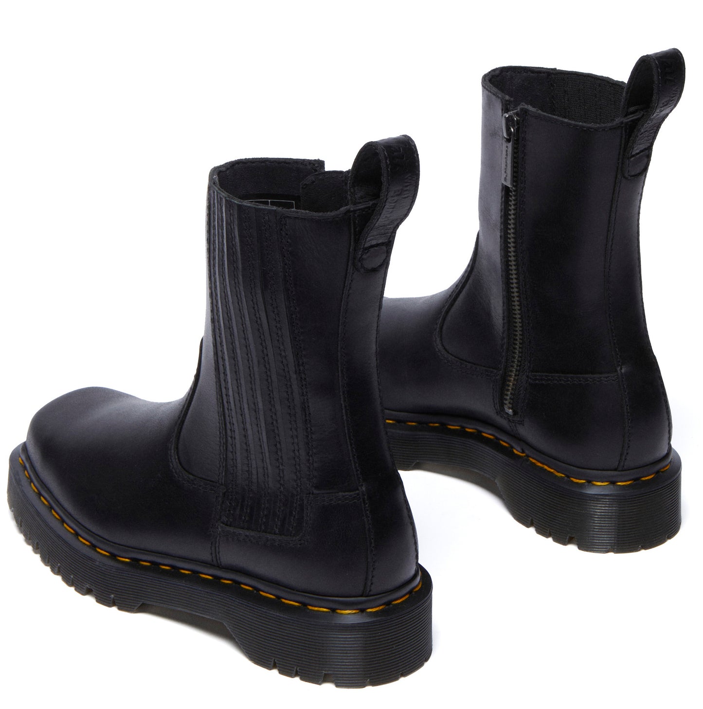 Two black ankle-high Chelsea boots with side zipper and platform soles.