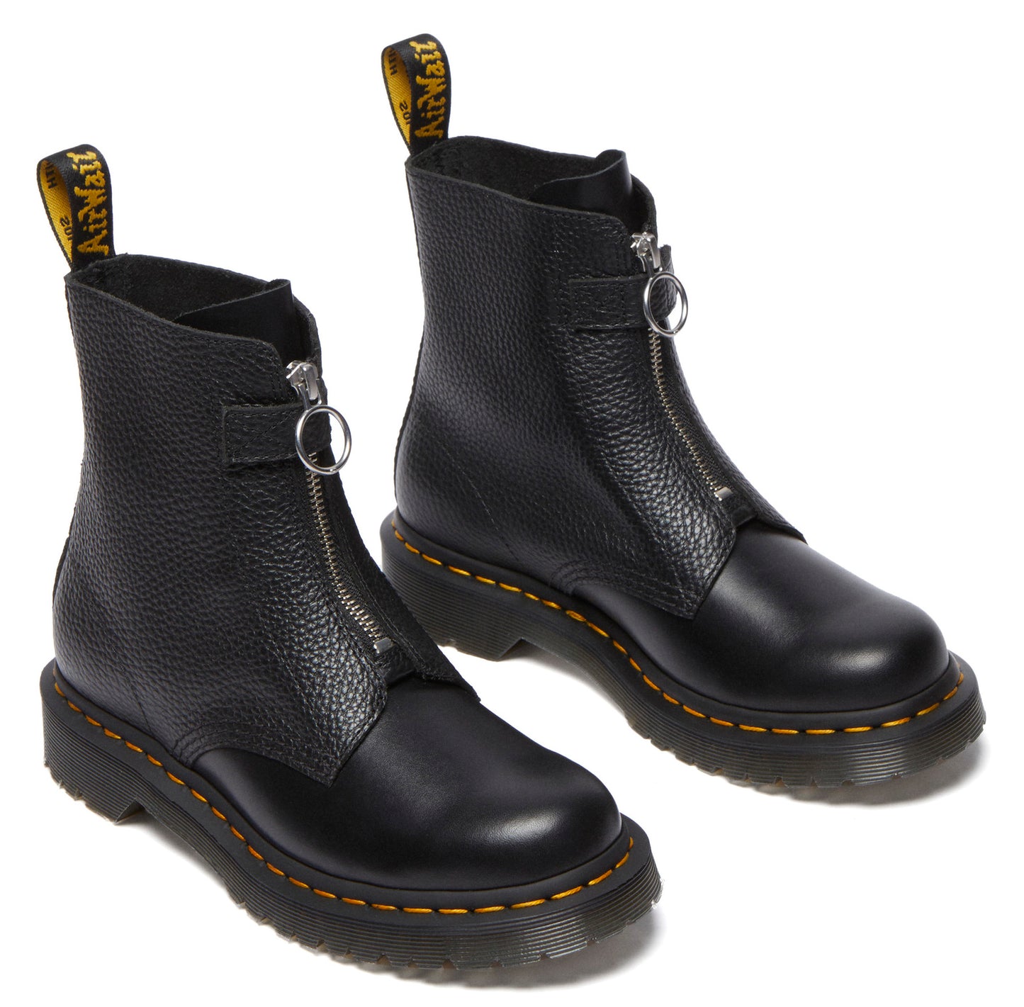 Pair of black leather ankle boots with yellow stitching and front zippers.