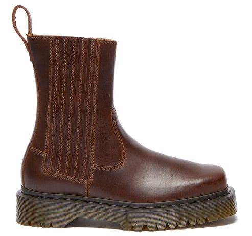 Brown ankle boot with elastic side panels and a thick lug sole.