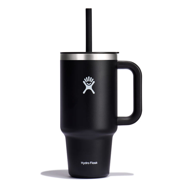 Black insulated mug with handle and straw, with a white logo of a person near a palm tree, and the words "Hydro Flask" near the bottom.