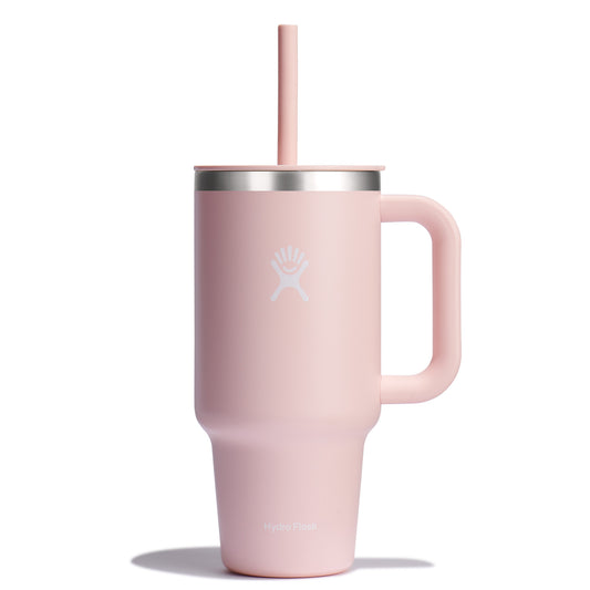 Pink tumbler with handle and straw.