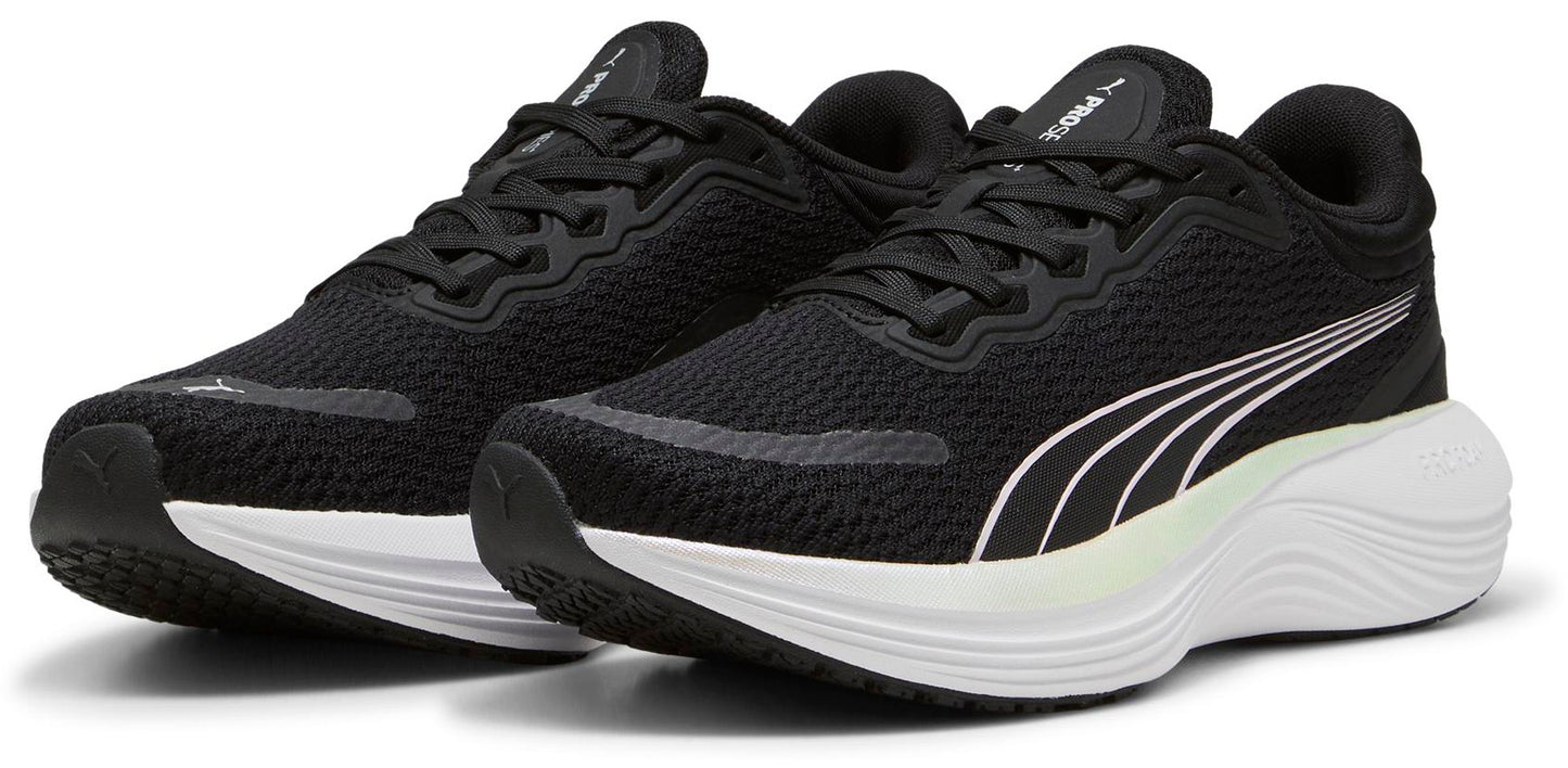 A pair of black running shoes with a white sole and white stripes on the side.