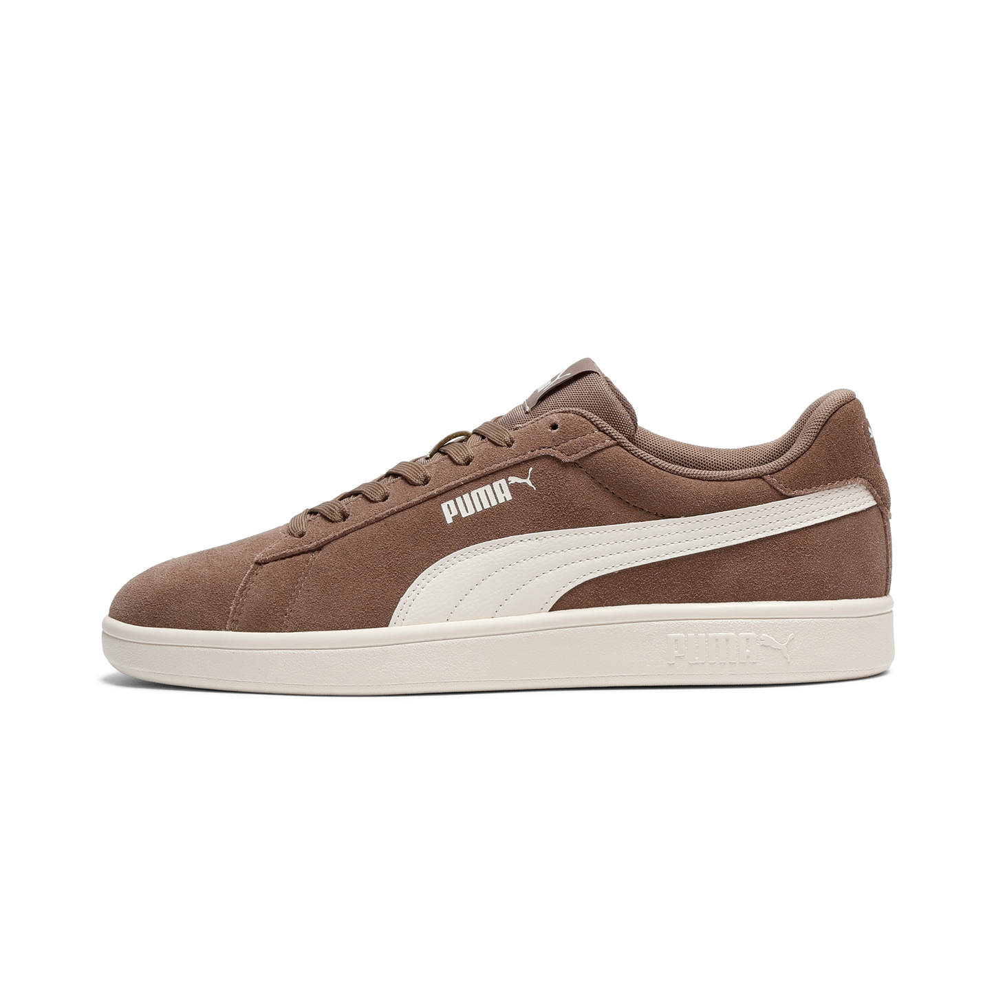 A brown low-top suede shoe with a white stripe along the side.