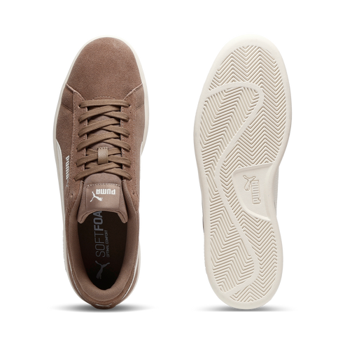 Top-down view of a brown suede sneaker with white sole; the insole has the text "SOFTFOAM+" printed on it; the bottom of the sole has the text "PUMA" printed on it.