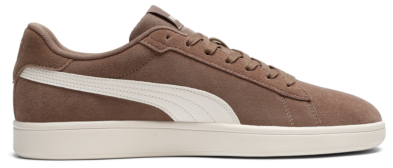 A brown suede sneaker with a white stripe and white sole.