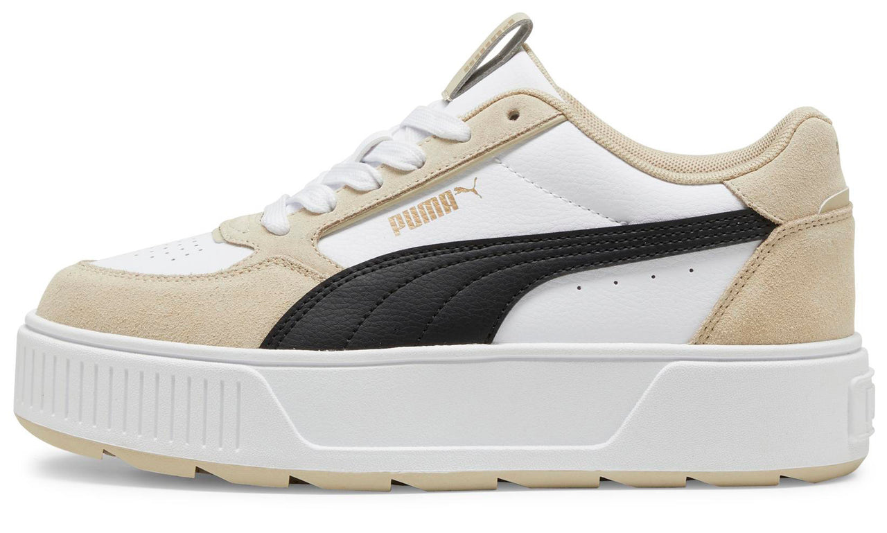 A platform sneaker in white and black, with 'PUMA' in gold lettering on the side.