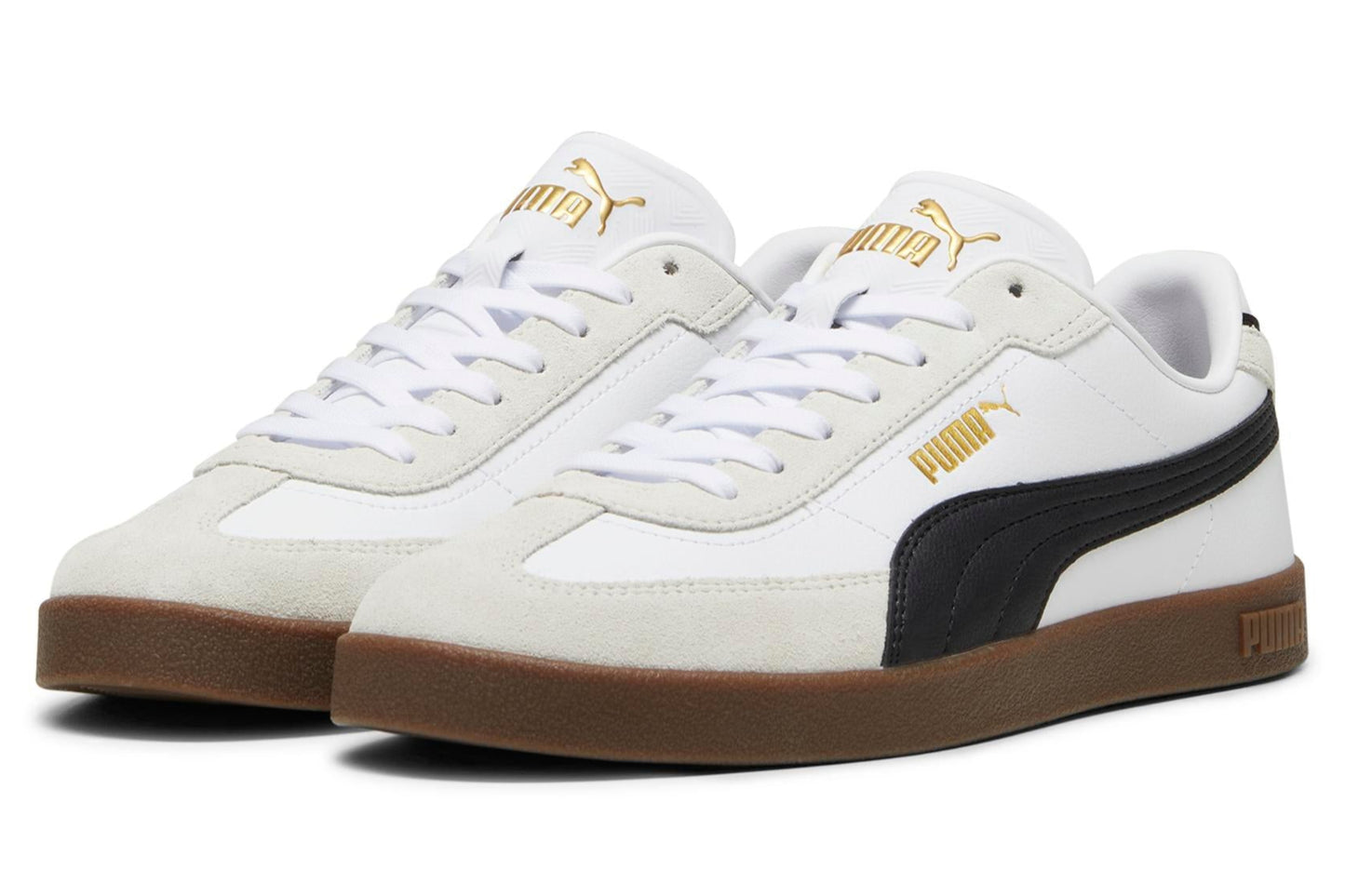 A pair of white sneakers with a brown sole and black stripe. The word PUMA is printed in gold.