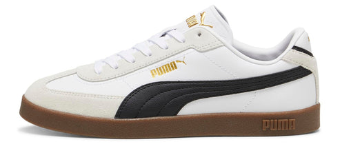 A white sneaker with a black stripe and brown sole.