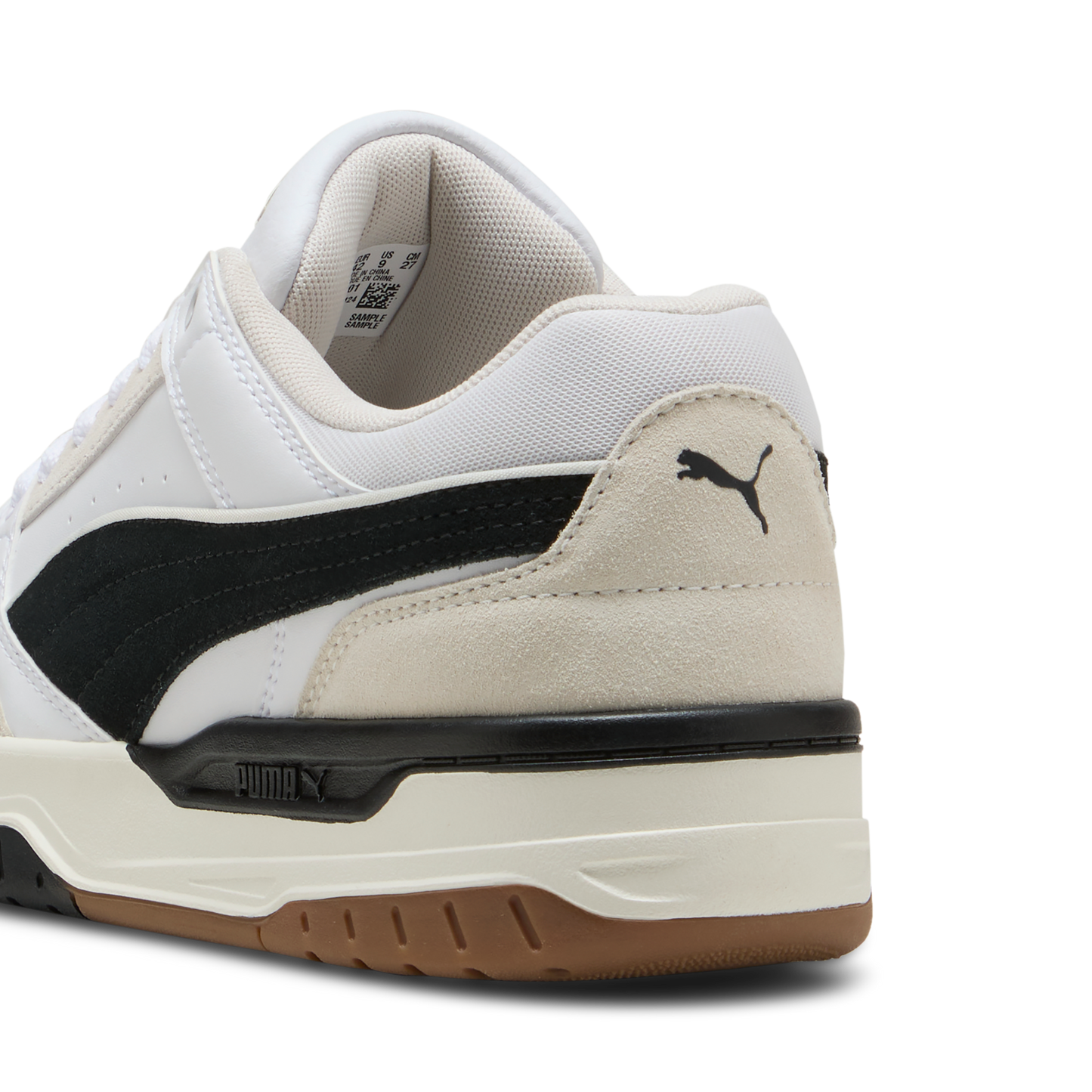 White low-top sneaker with black stripe and logo near the heel.