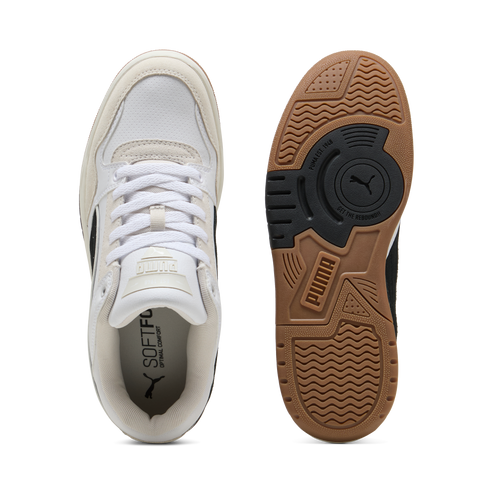 Overhead view of white tennis shoes, showing shoelaces and insole, with the outsole showing a PUMA logo and tread.