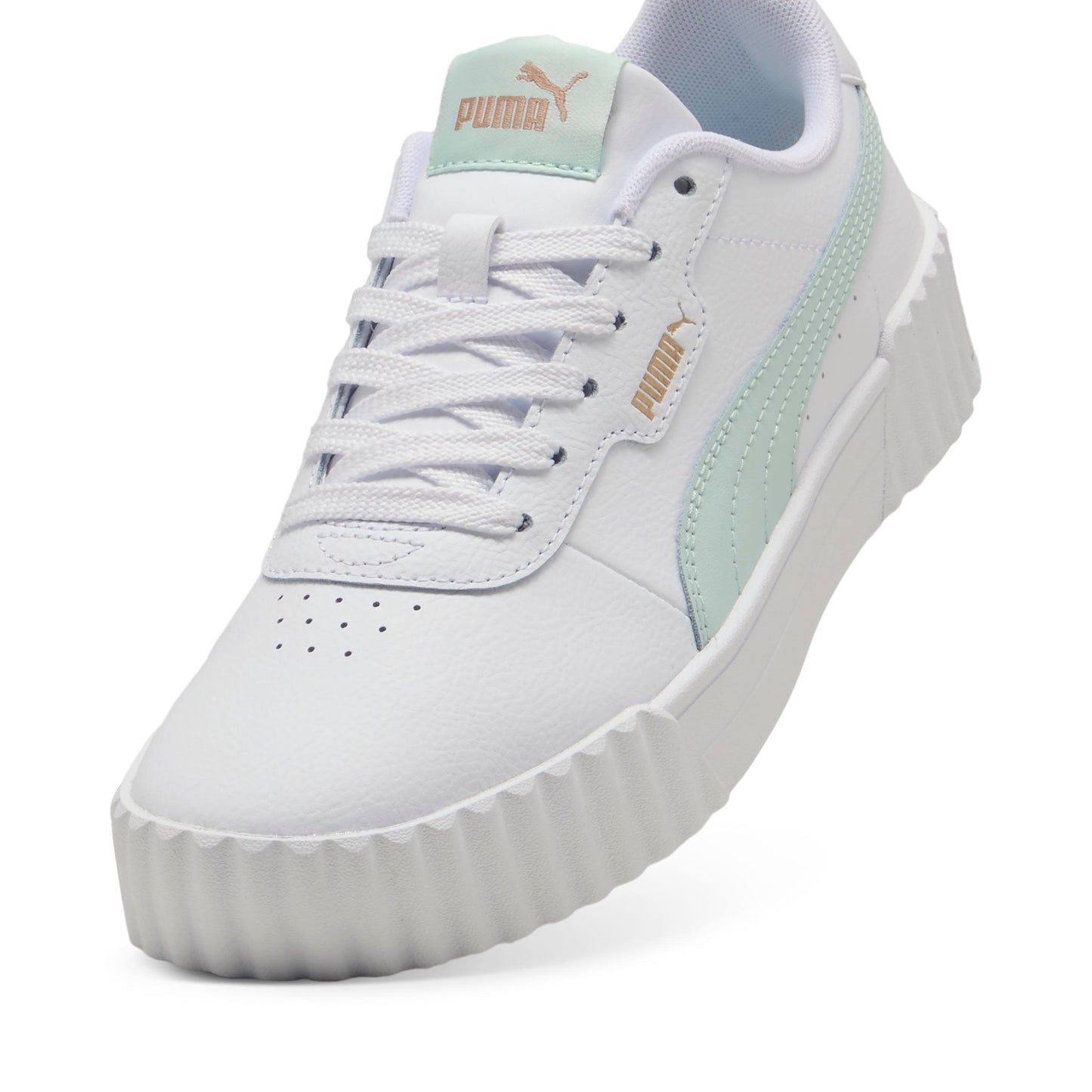 White sneaker with platform sole, light green accents, and light green "puma" logo.