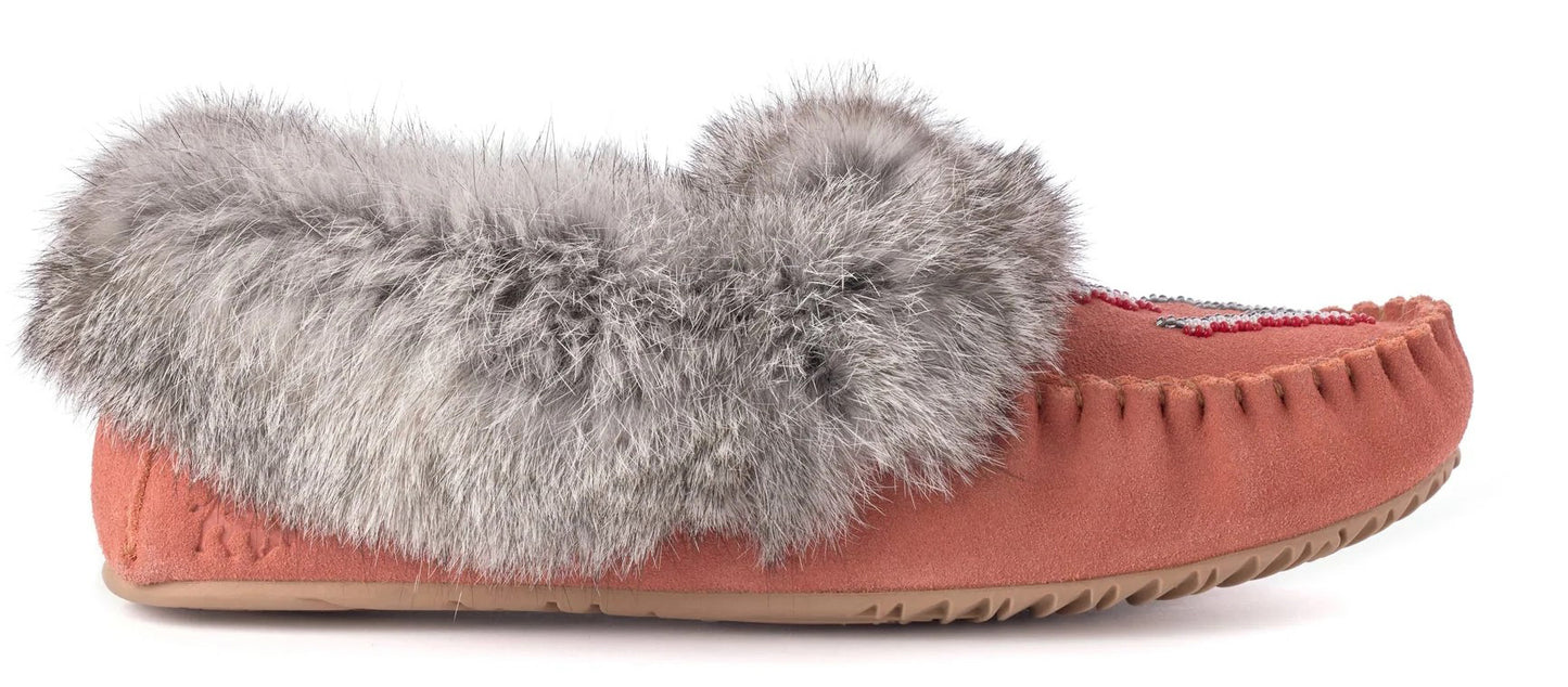 A salmon-colored moccasin slipper trimmed with gray fur.