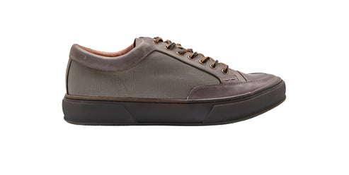 A low profile gray leather sneaker with a rounded toe and lace-up closure.