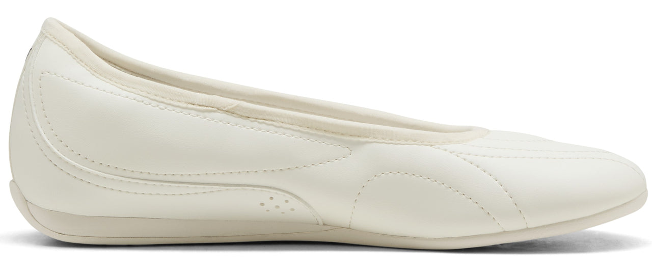 A white flat shoe.