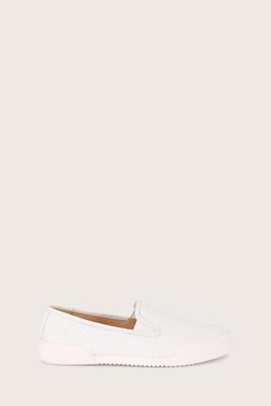 White, canvas slip-on shoe with rubber sole.