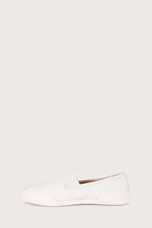 White slip-on shoe with a rounded toe and a flat sole.