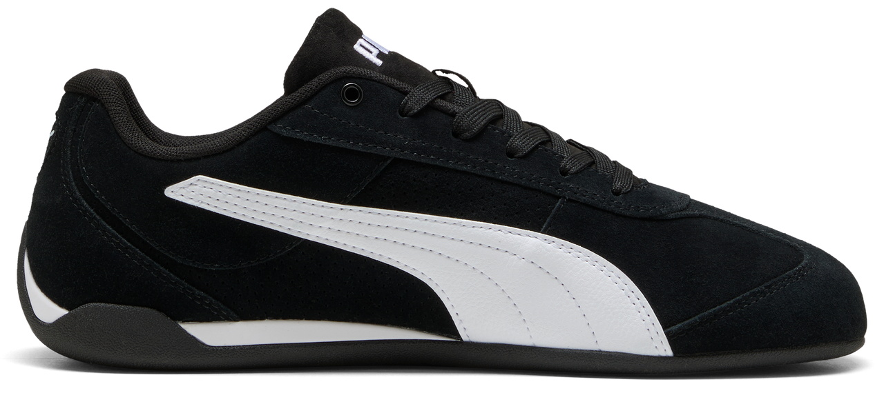 Black sneaker with white stripe.