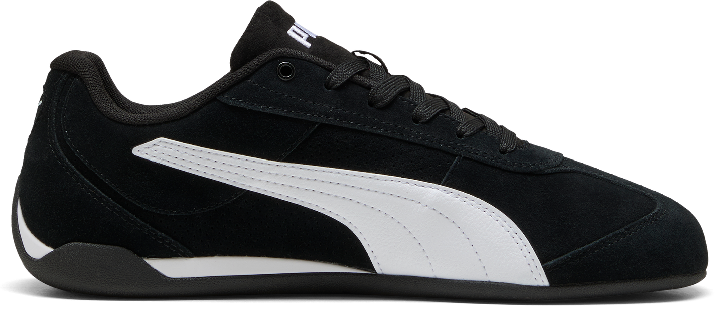 A black sneaker with white stripes.