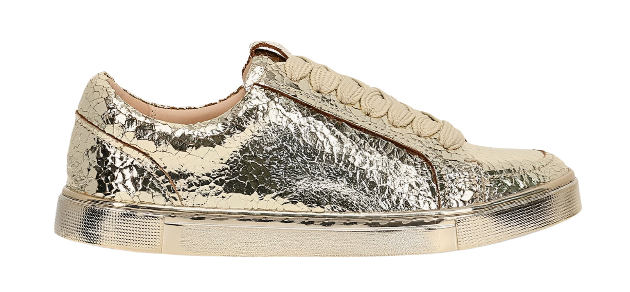 Low-rise, metallic silver sequined sneaker with off-white sole.