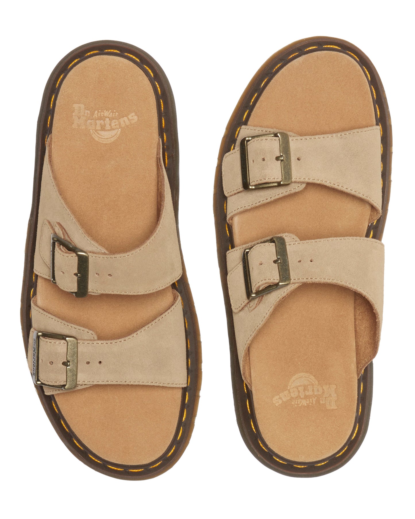 Pair of beige slide sandals with adjustable straps and buckle closures.