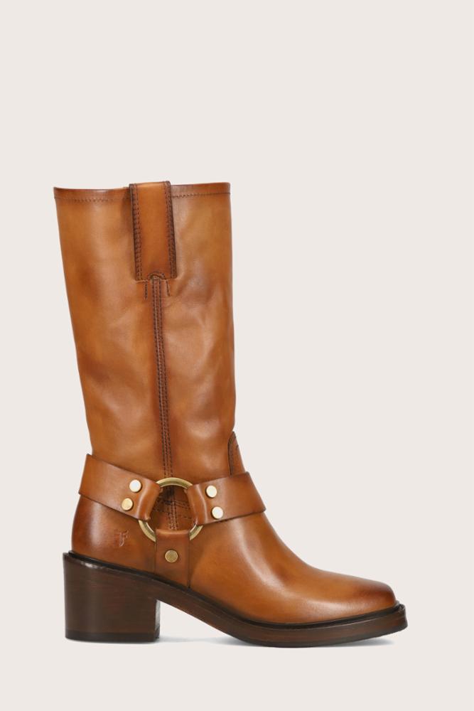 Tall brown leather boot with a square heel and a gold-tone buckle harness strap.