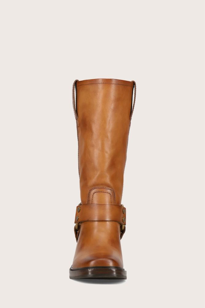 Front view of a knee-high brown leather boot with a buckled strap detail around the ankle.