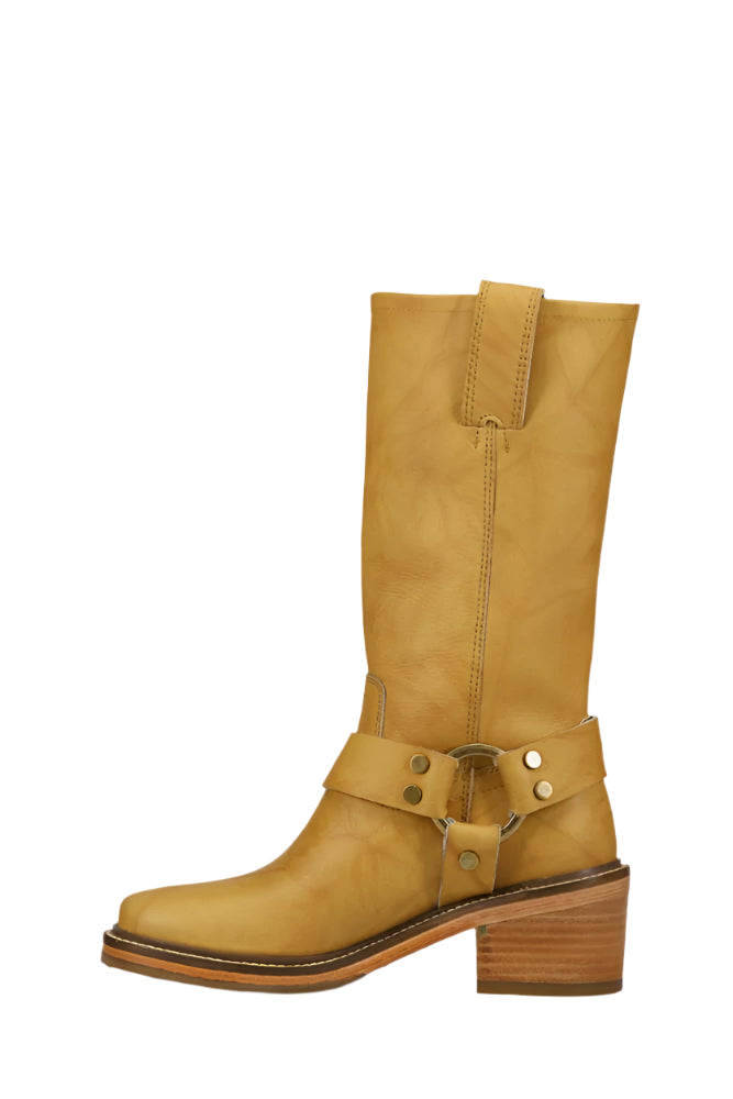Mid-calf-length yellow leather boot with a block heel and a decorative harness detail.
