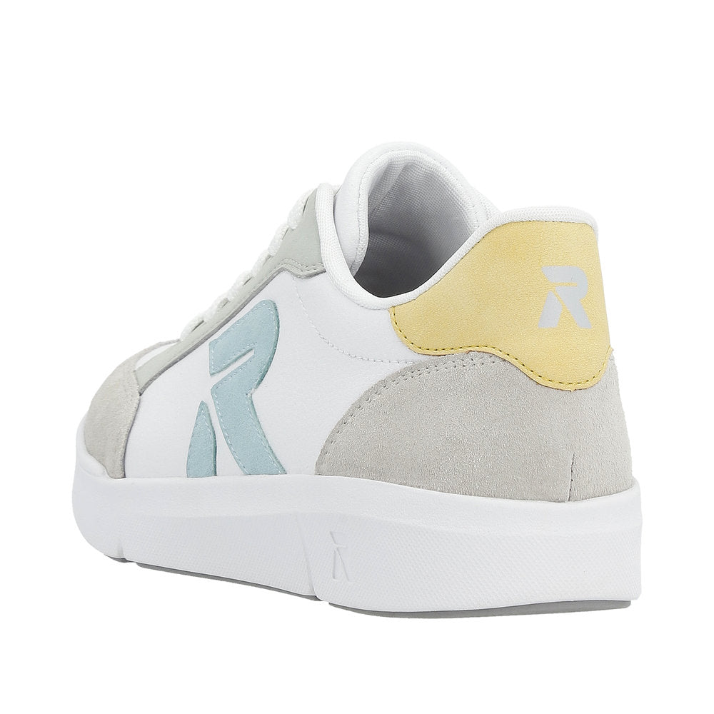 Close-up of a white sneaker with a light blue 'R' logo and a yellow heel patch with a gray 'R' logo.