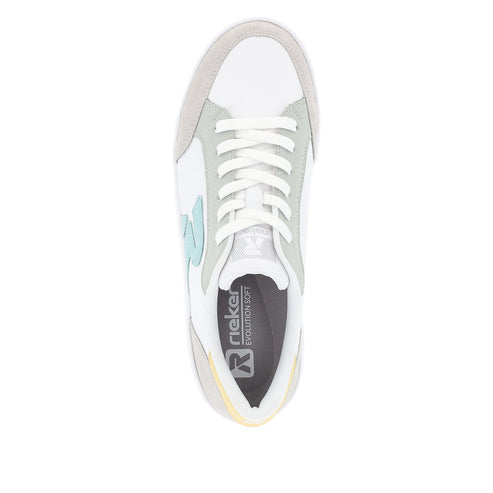 Top-down shot of a white sneaker with gray trim, light yellow accent at the heel, and logo "Rieker EVOLUTION SOFT" on the insole.