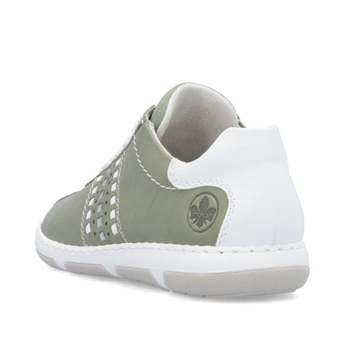Green sneaker with white heel cup and decorative cutouts along the side.