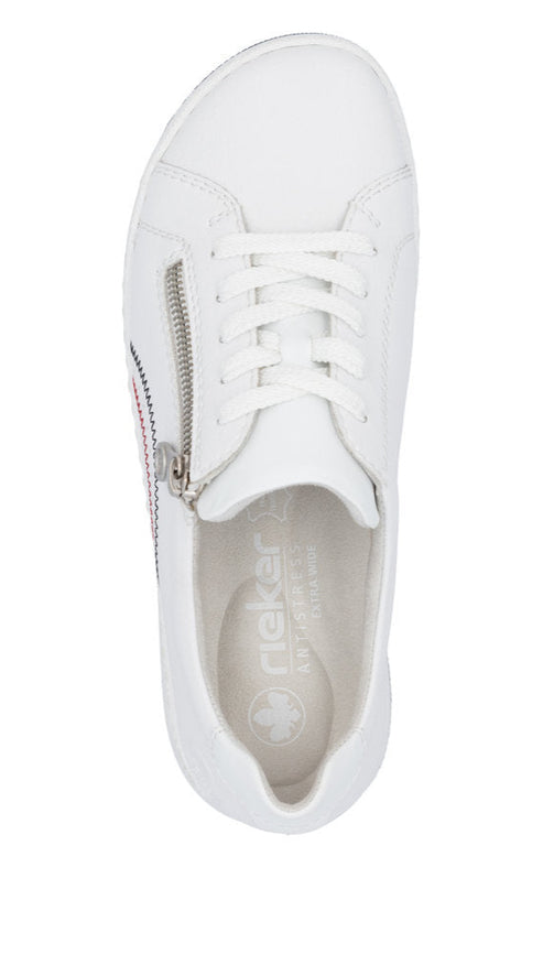 Top-down view of a white sneaker with white laces and a silver zipper on the side.
