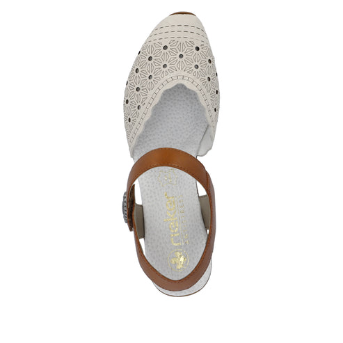 Top-down view of a women's off-white sandal with a brown ankle strap and a perforated floral pattern on the toe.