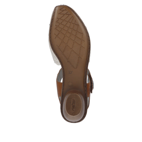 Bottom of a sandal with brown diamond-patterned sole and cylindrical heel.