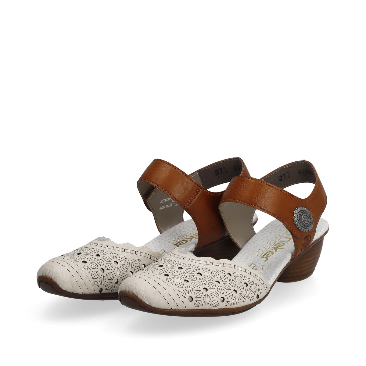 A pair of white shoes with flower cutouts and tan straps.