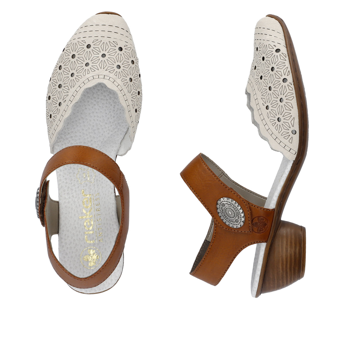Pair of white and tan heeled sandals with flower perforations.