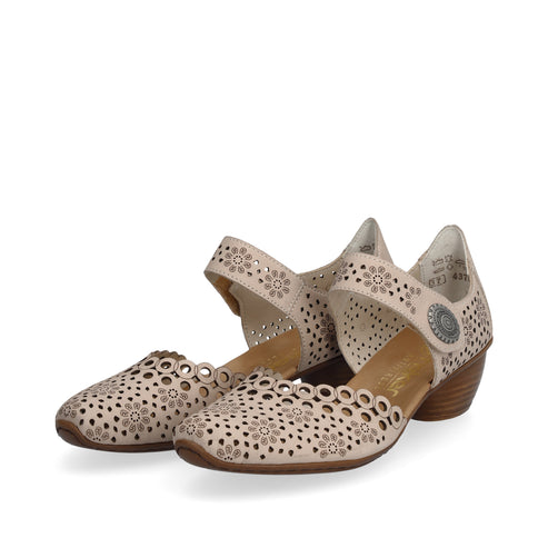 Beige Mary Jane style pumps with laser cut flower designs.