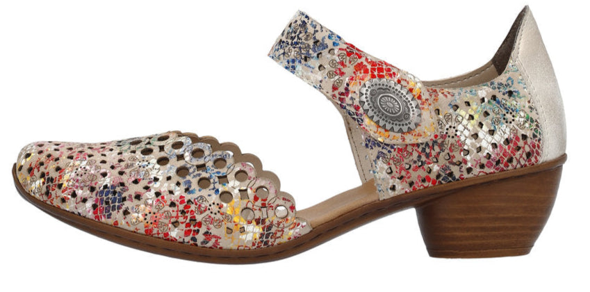 A woman's multi-colored shoe with a low heel.