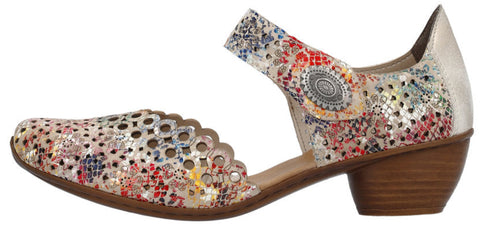 A woman's multi-colored shoe with a low heel.