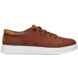 A brown sneaker with white sole, laces, and a leather heel pull tab.