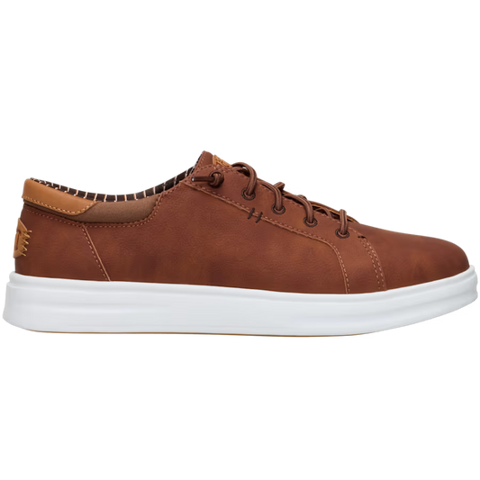 A brown sneaker with white sole, laces, and a leather heel pull tab.