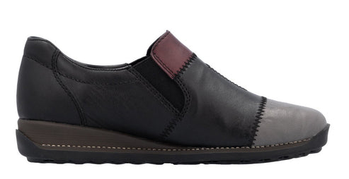 Slip-on shoe with black leather upper, grey toe, and maroon accent.