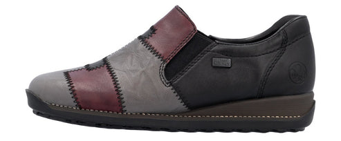 Patchwork slip-on shoe with a low wedge heel.