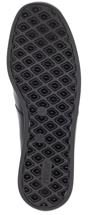 Sole of a shoe with a geometric pattern.