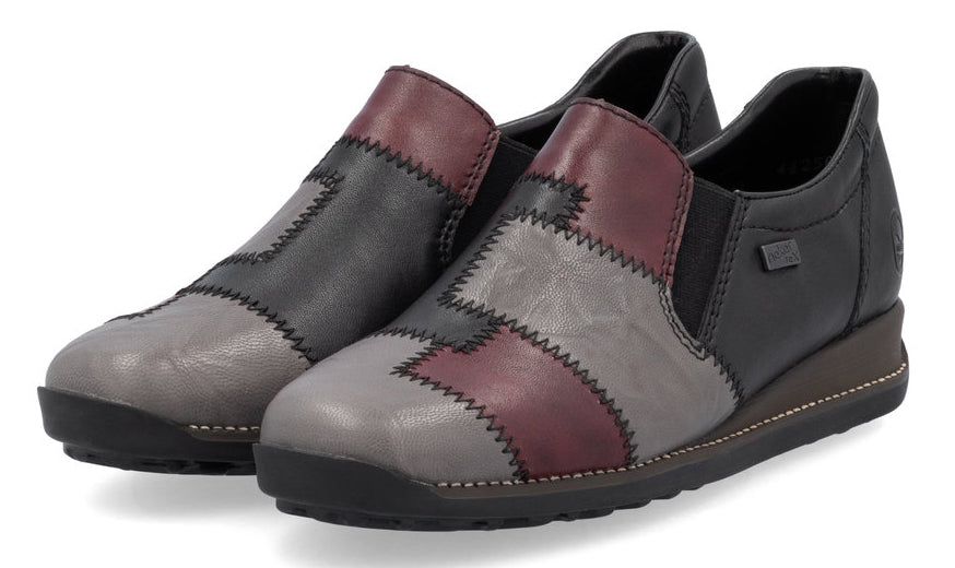 Pair of slip-on patchwork wedge heel shoes with dark sole