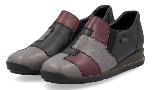 Pair of slip-on patchwork wedge heel shoes with dark sole