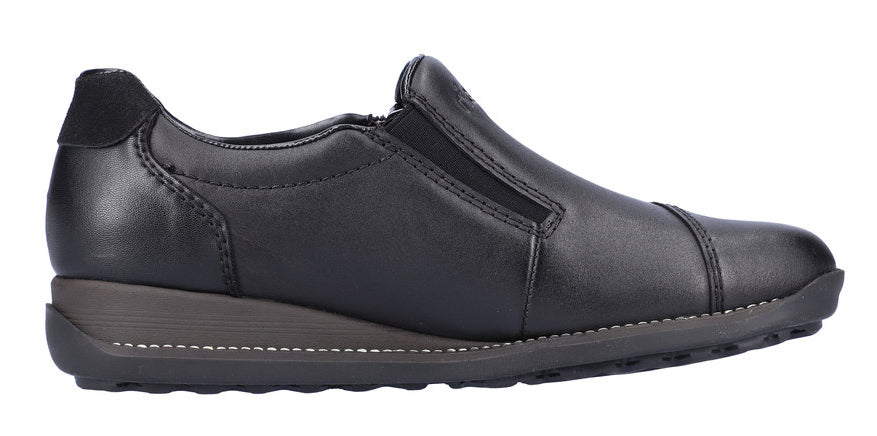 A black slip-on shoe with a low wedge heel.