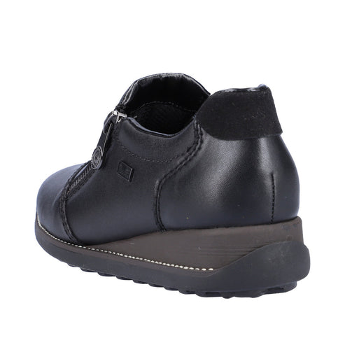 Low black leather shoe with zipper and a low wedge sole.