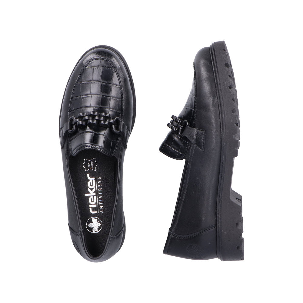 Pair of black loafers with faux crocodile skin texture, chain detailing, and chunky sole; insole features visible 'Rieker Antistress' logo.
